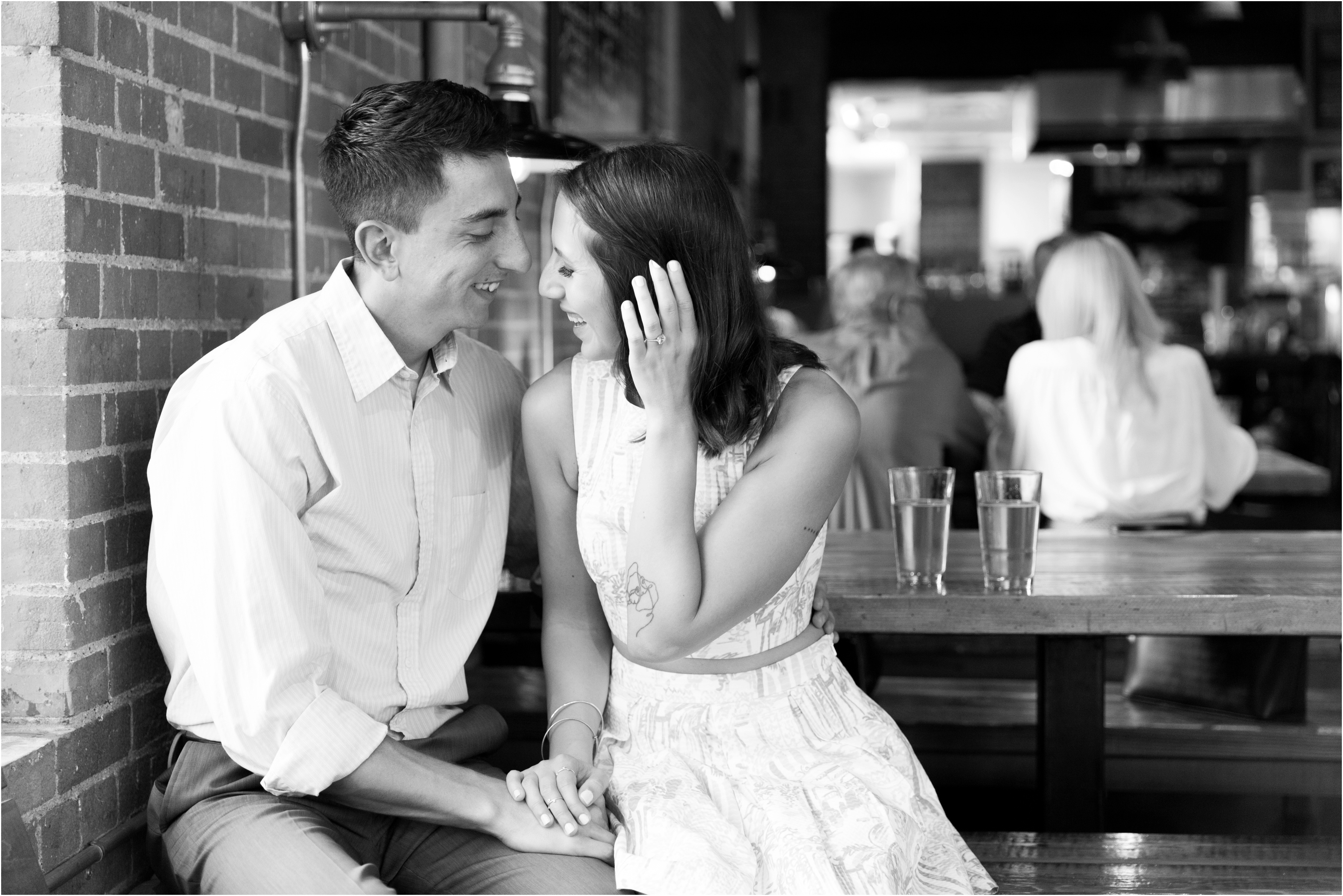 Black and white photo of a couple at a bar