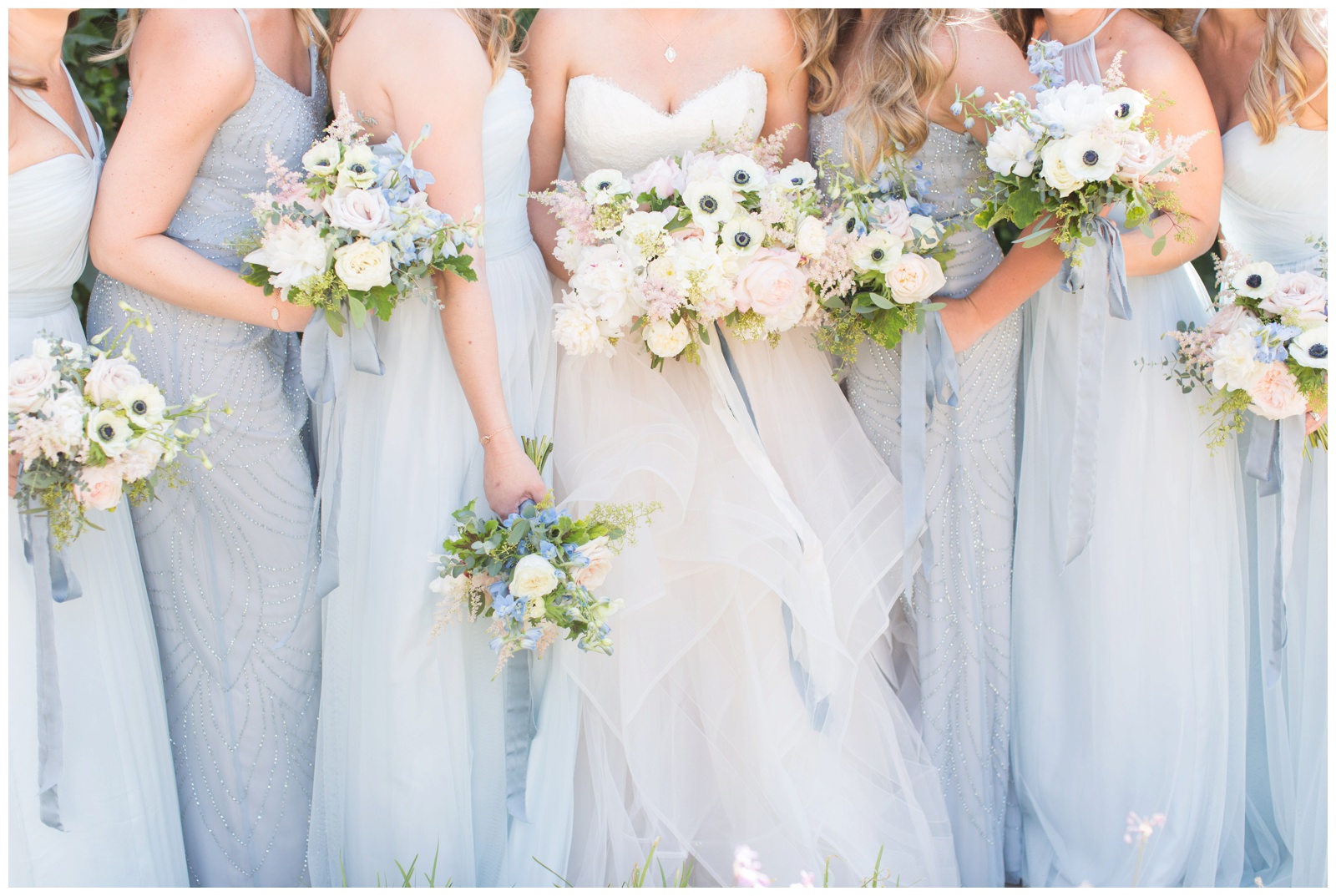 Blue Bridesmaids dresses with pink, white and blue bouquets