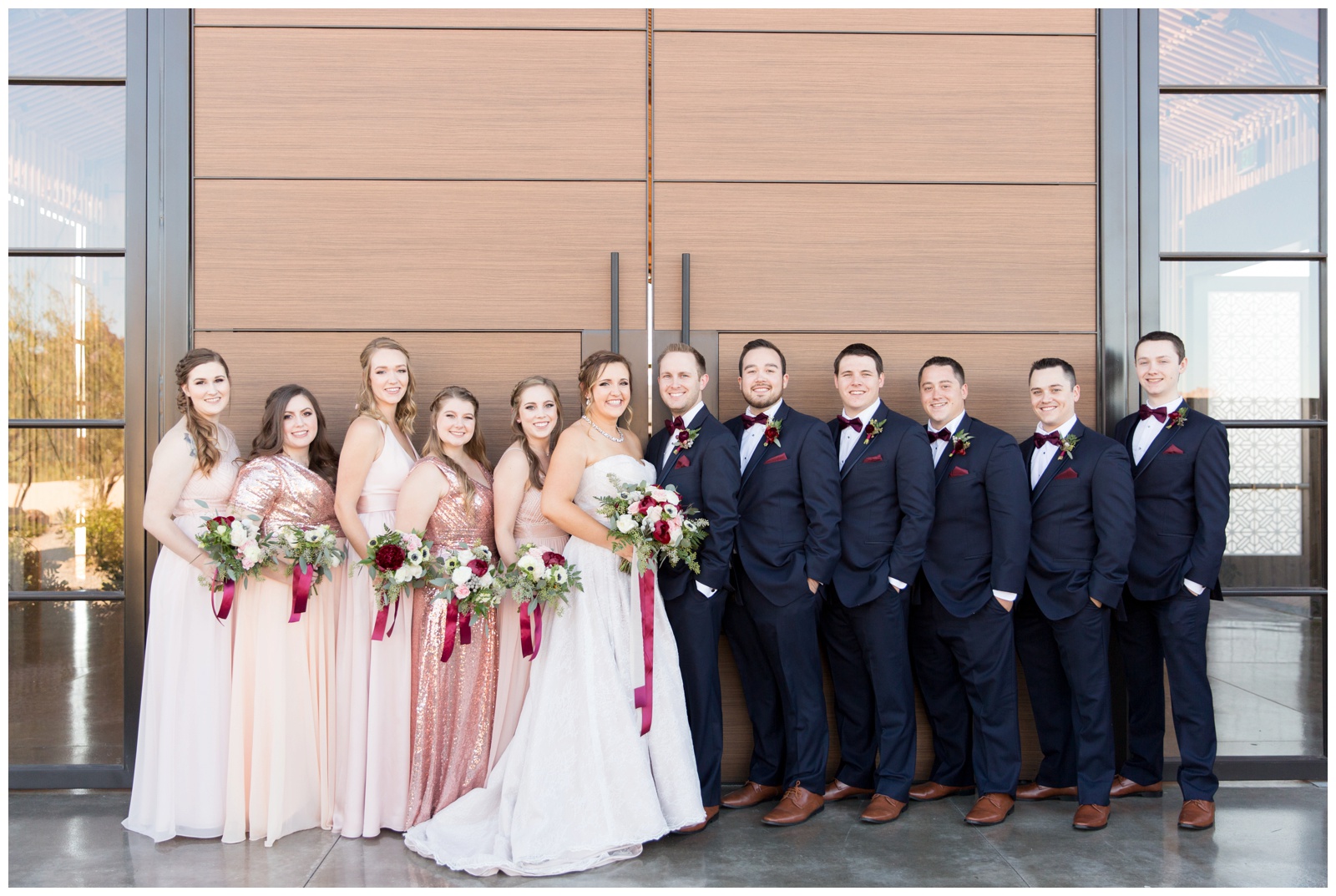 Bridesmaids and groomsmen outside The Paseo 