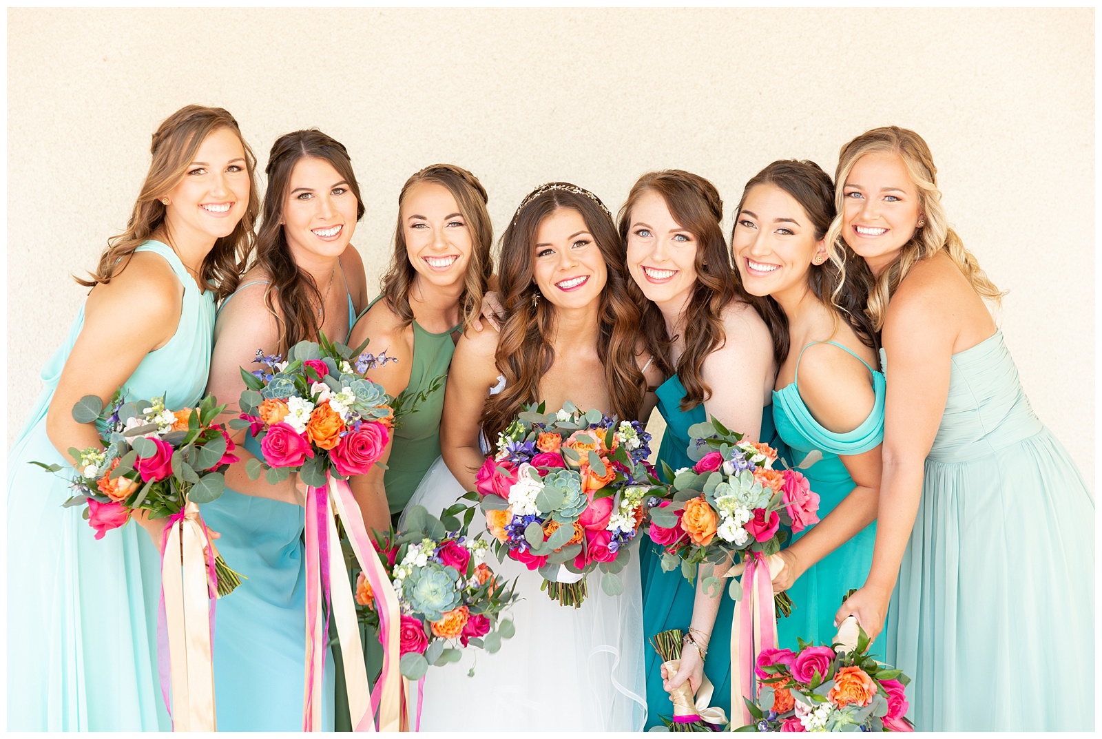 blue bridesmaid dresses with colorful bouquets 